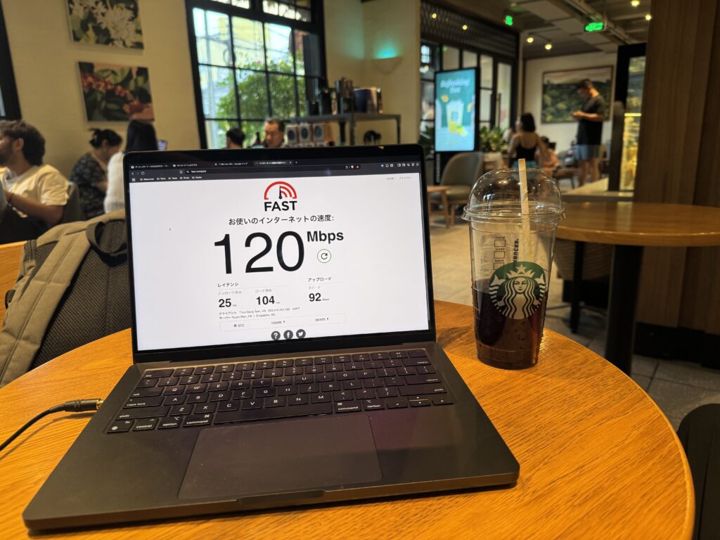 Speed test result showing 120 Mbps download on laptop at Hoi An Starbucks