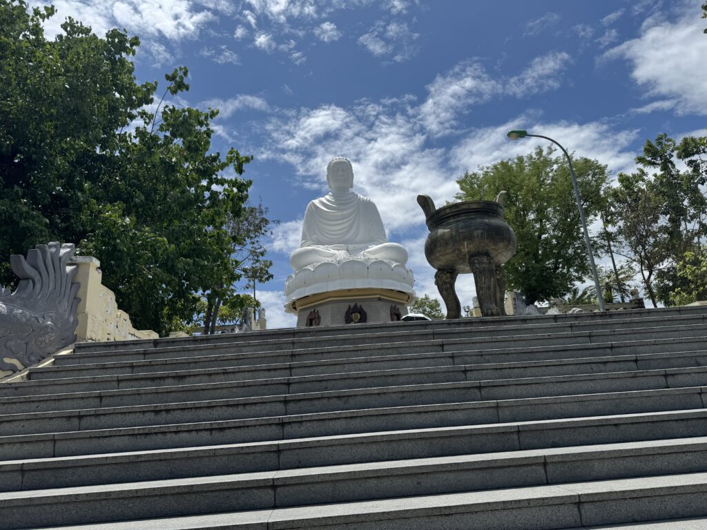 Giant white Buddha statue at Long Son Pagoda